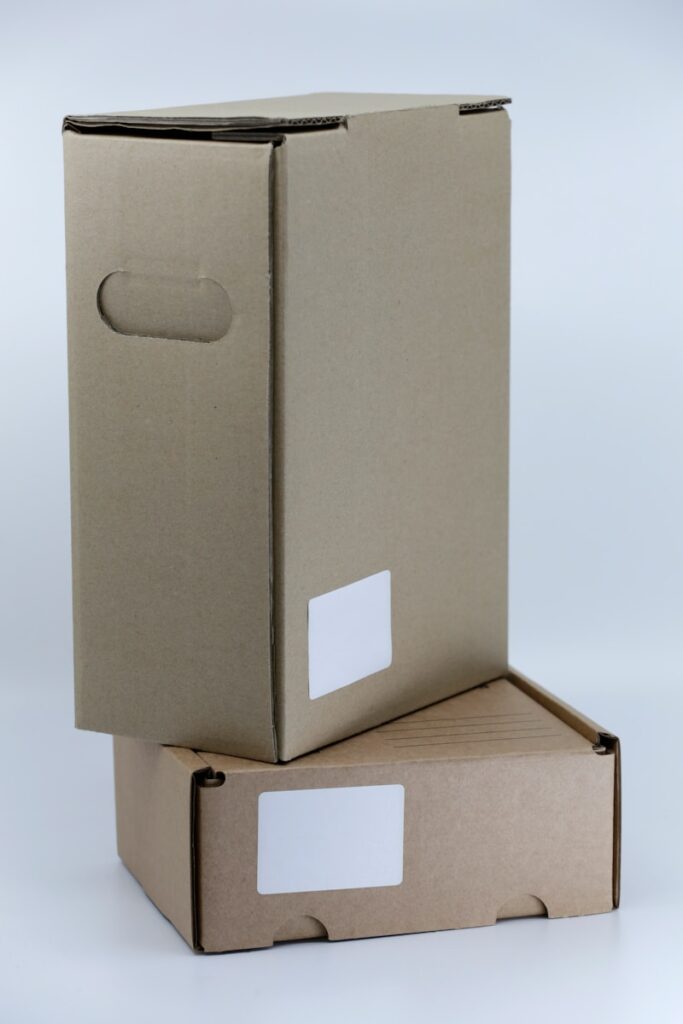 gray cardboard box on white table “Hide.me VPN home screen showing active free server location”