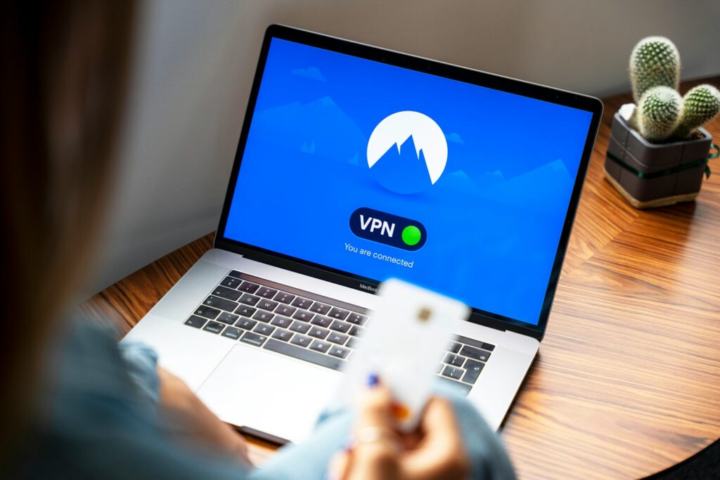 macbook pro on brown wooden table ready for VPN Usage
