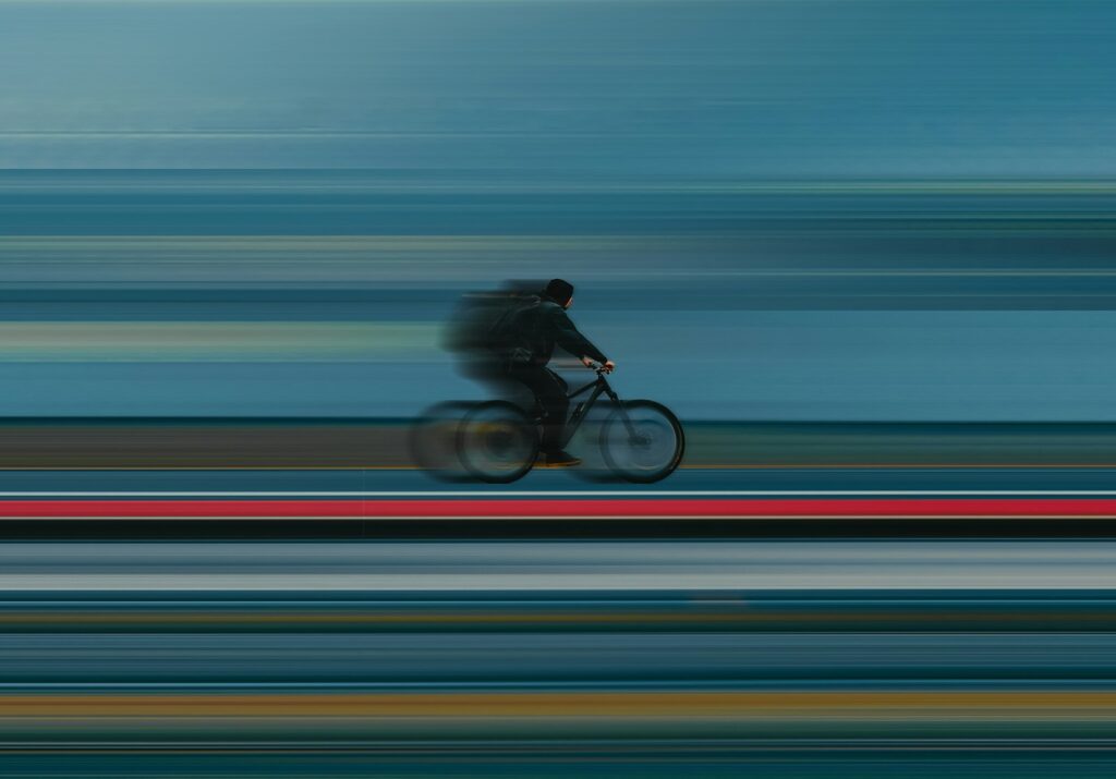 a blurry photo of a person riding a bike “Web designer testing international UX with VPN enabled on Firestick”