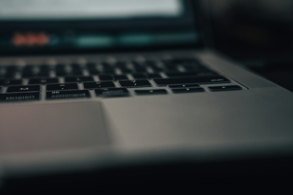 a close up of a laptop with a blurry background