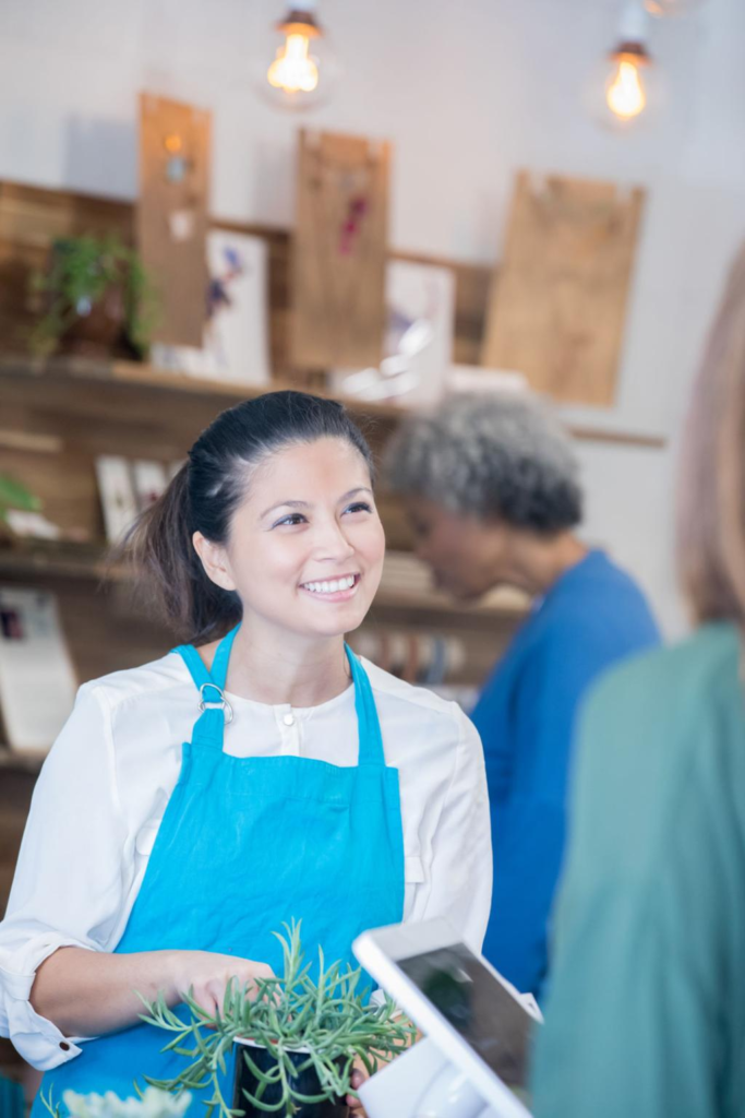 Small business owner responding to positive customer feedback