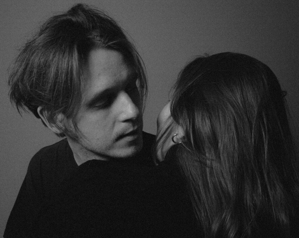 Man and woman looking at each other closely